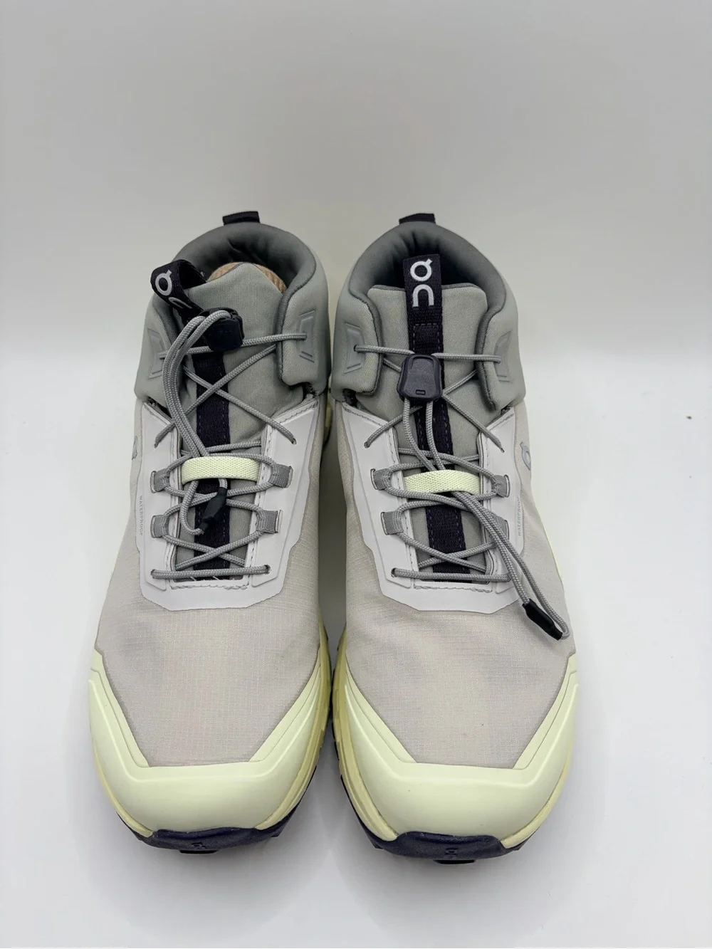 On Cloud Cloudhero Mid-Top Sneakers in Light Gray and Pale Yellow
